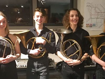 Students holding their French horn