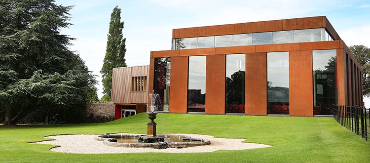 Cedars Hall with its fountain in the summer