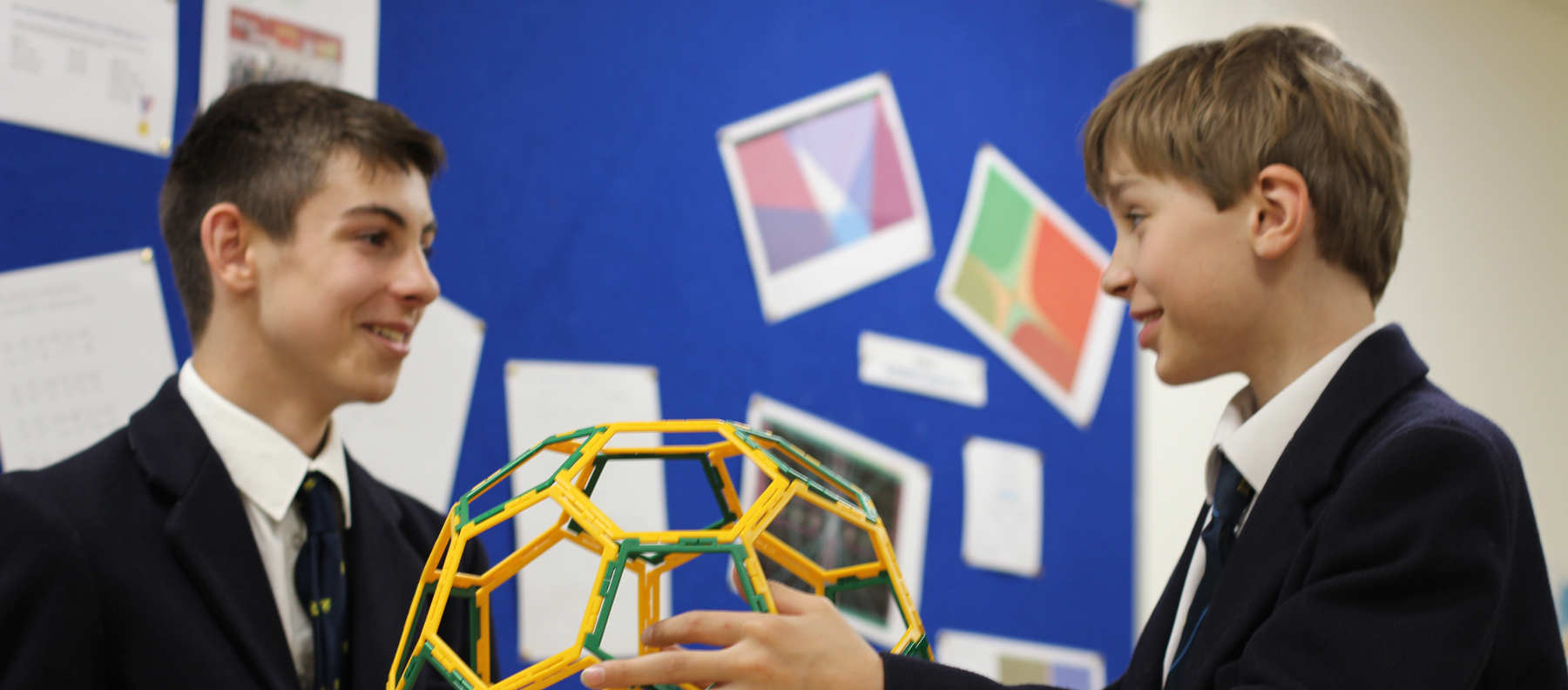 Two boys with a 3d maths object