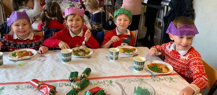 Children enjoying Christmas lunch