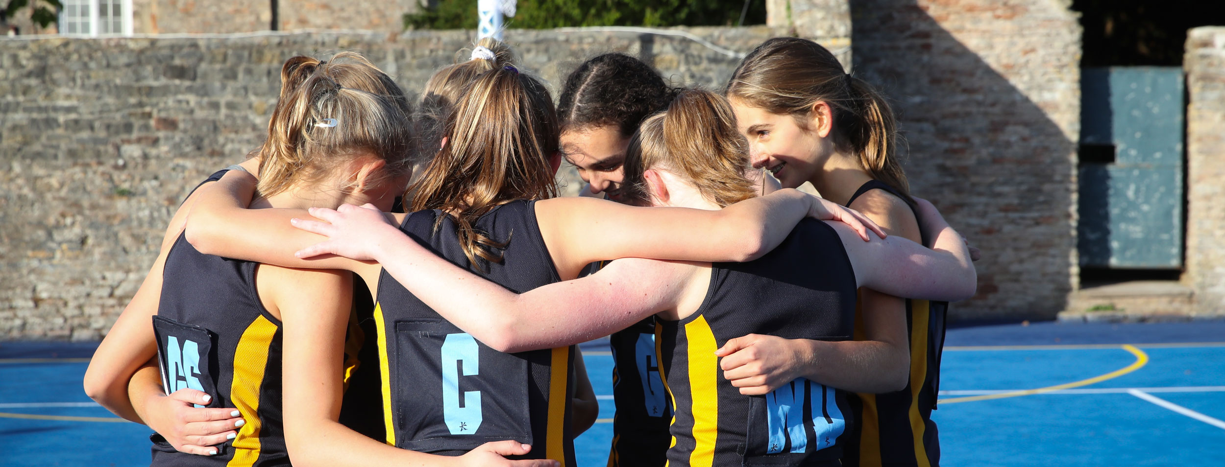 Girls playing netball at our Independent School in Somerset