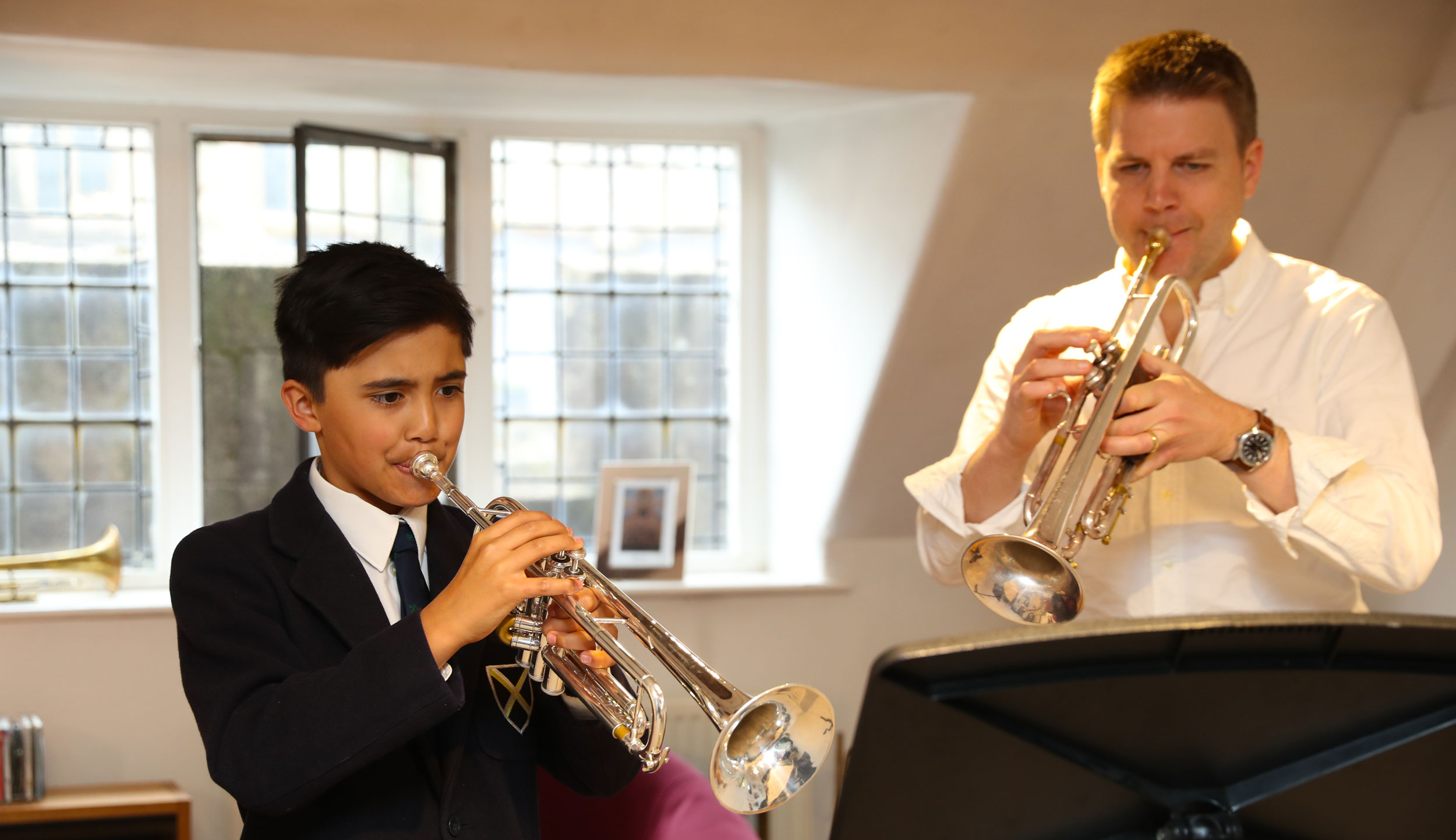 Brass Co-ordinator with a pupil at our Specialist Music School