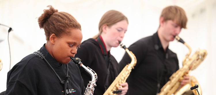 Three pupils performing at the annual Jazz Picnic at Wells Music School