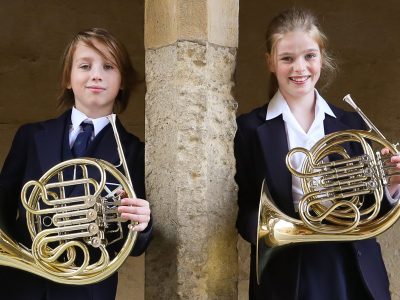 Two pupils playing French Horn at our Specialist Music School in Somerset England