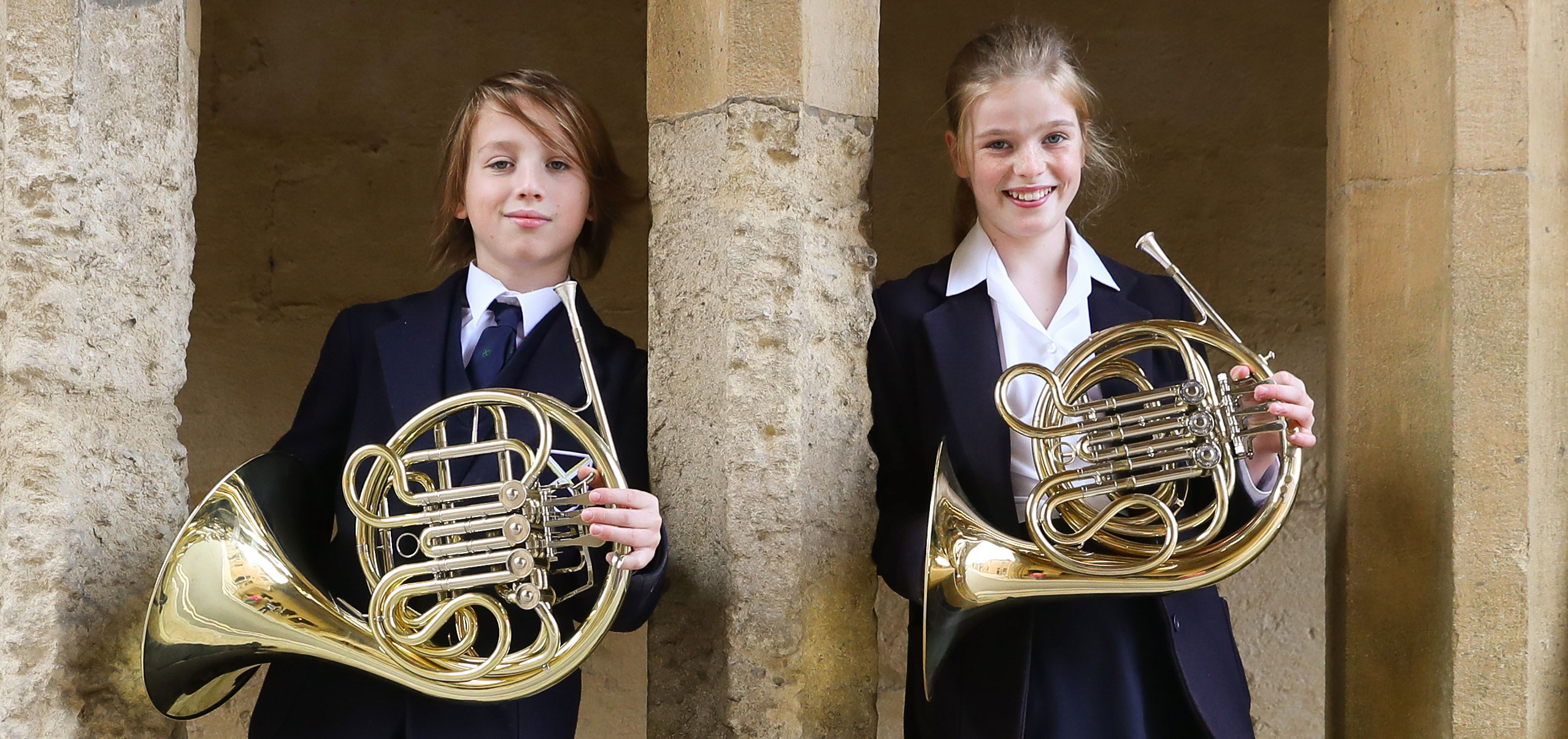 Two pupils playing French Horn at our Specialist Music School in Somerset England