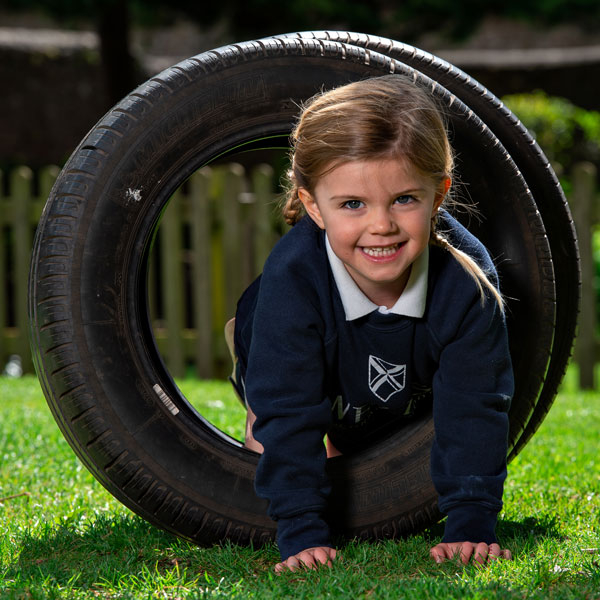 Child playing outside at our Independent Pre-Prep in Wells, Somerset