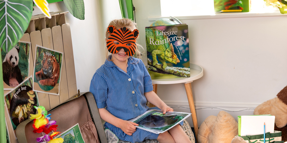 Girl in a jungle den at our Independent Pre-Prep in Wells, Somerset