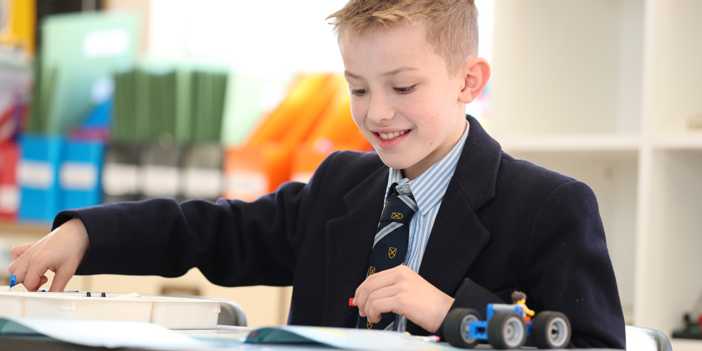 Boys walking down Vicars Close at dusk