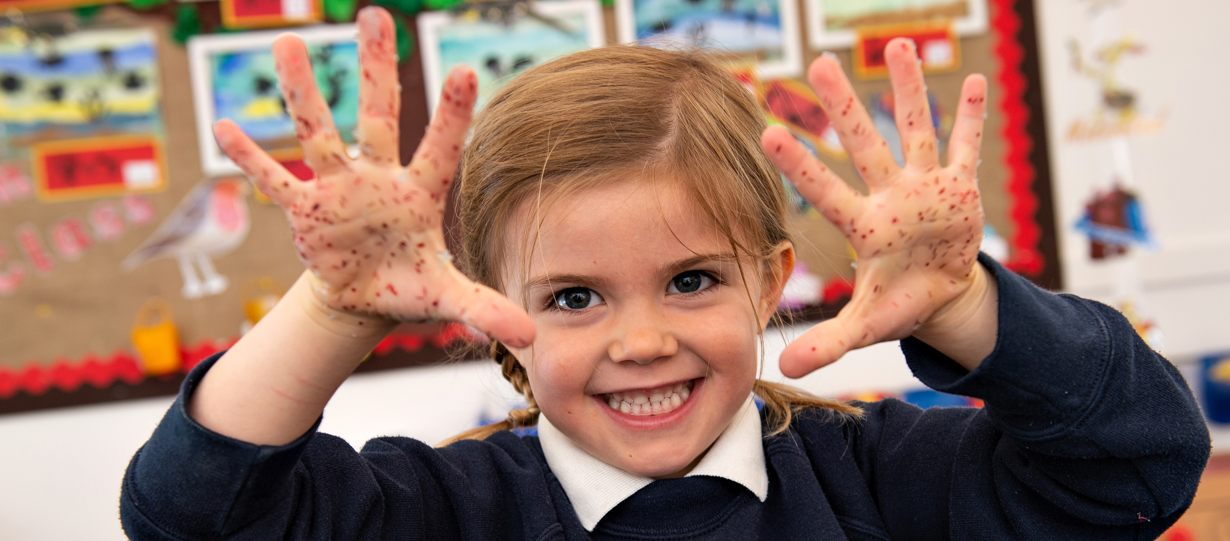 Girl with glittery hands at our Independent Pre-Prep in Wells, Somerset