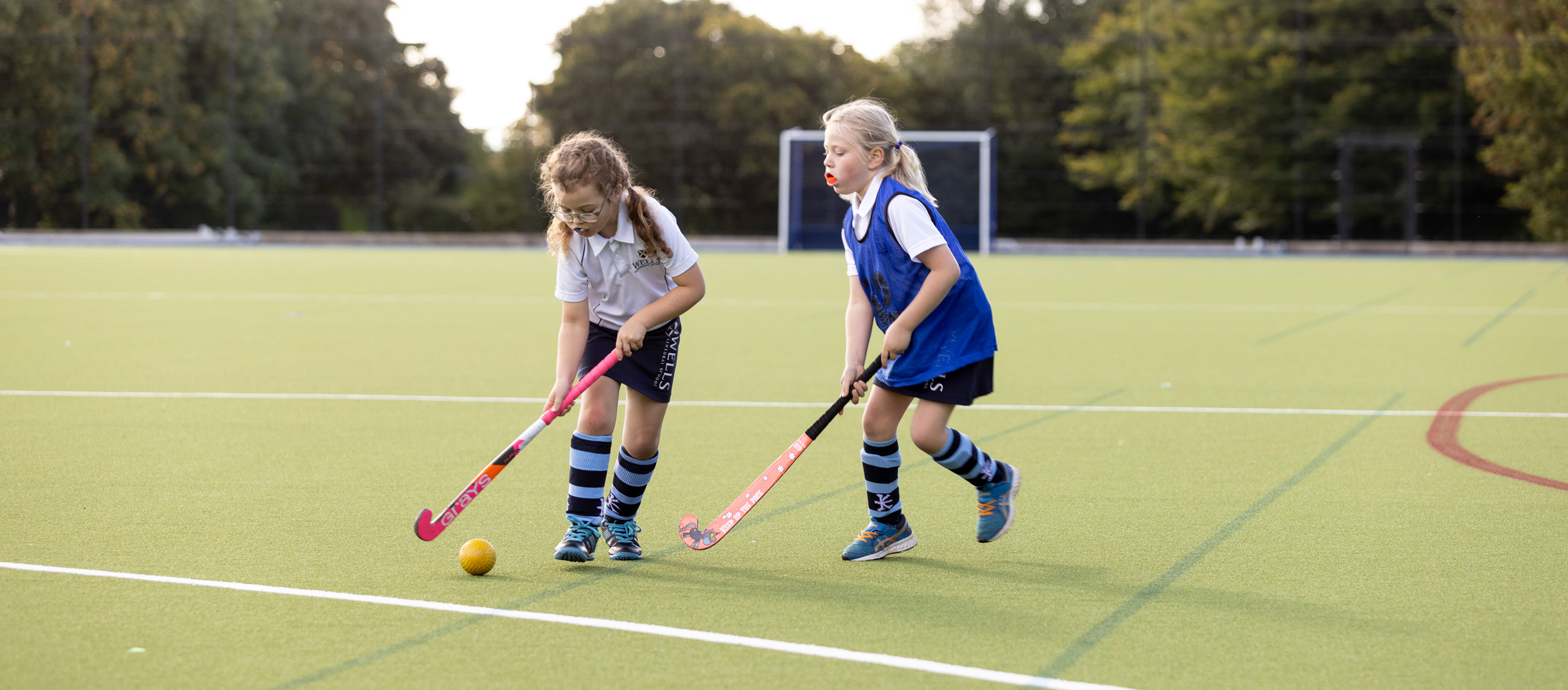 Prep School girls playing hockey at our Independent Prep School in Wells, Somerset