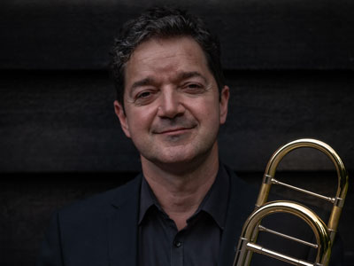 Portrait photo of Tom Lees, trombone teacher at our Specialist Music School in England