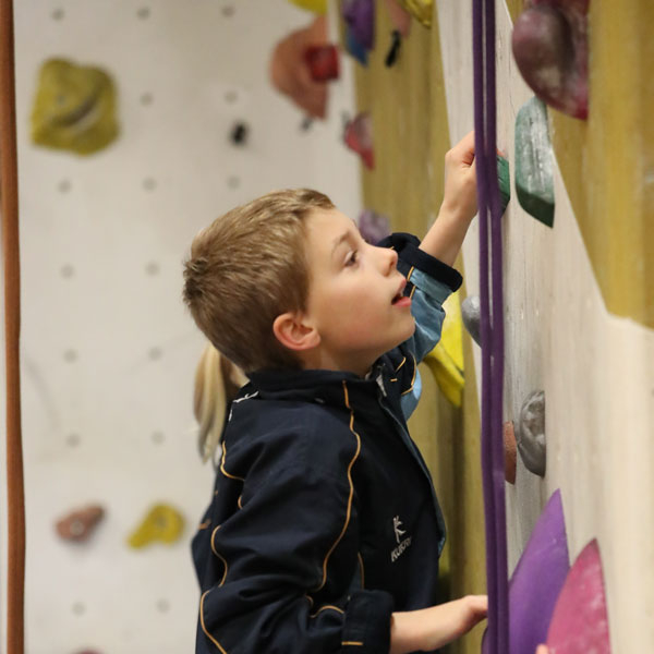 Boy on a climbing wall at our Independent Prep School in Wells Somerset