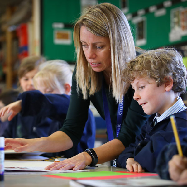 Teacher helping pupil at our Independent Prep School in Wells Somerset