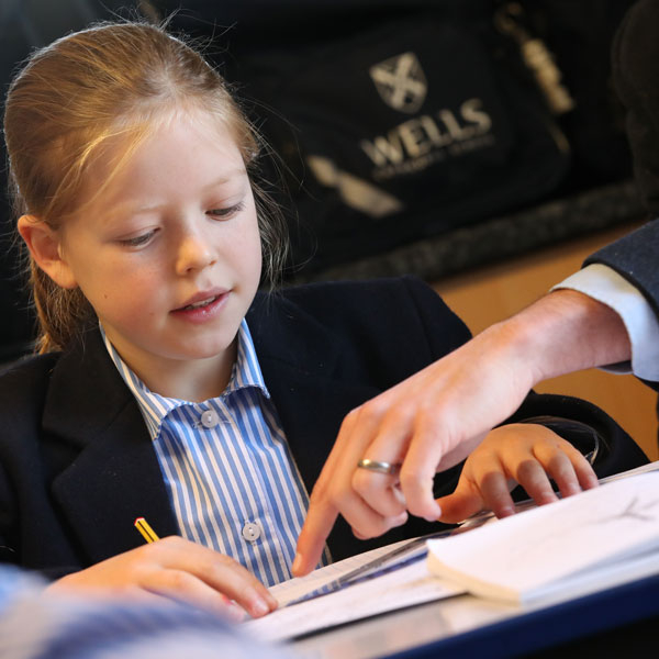 Teacher helping pupil at our Independent Prep School in Wells Somerset