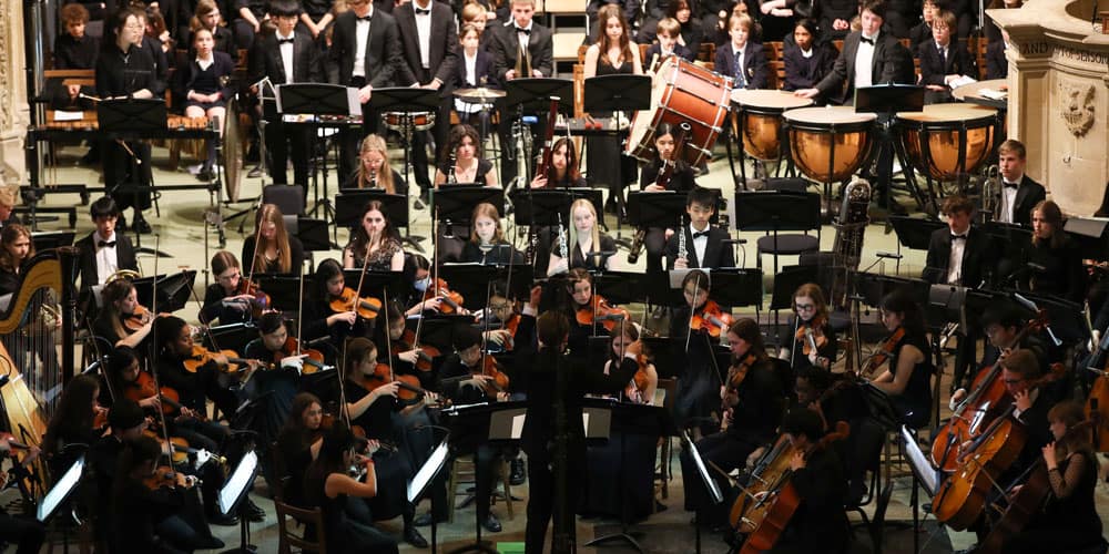 Boys walking down Vicars Close at dusk