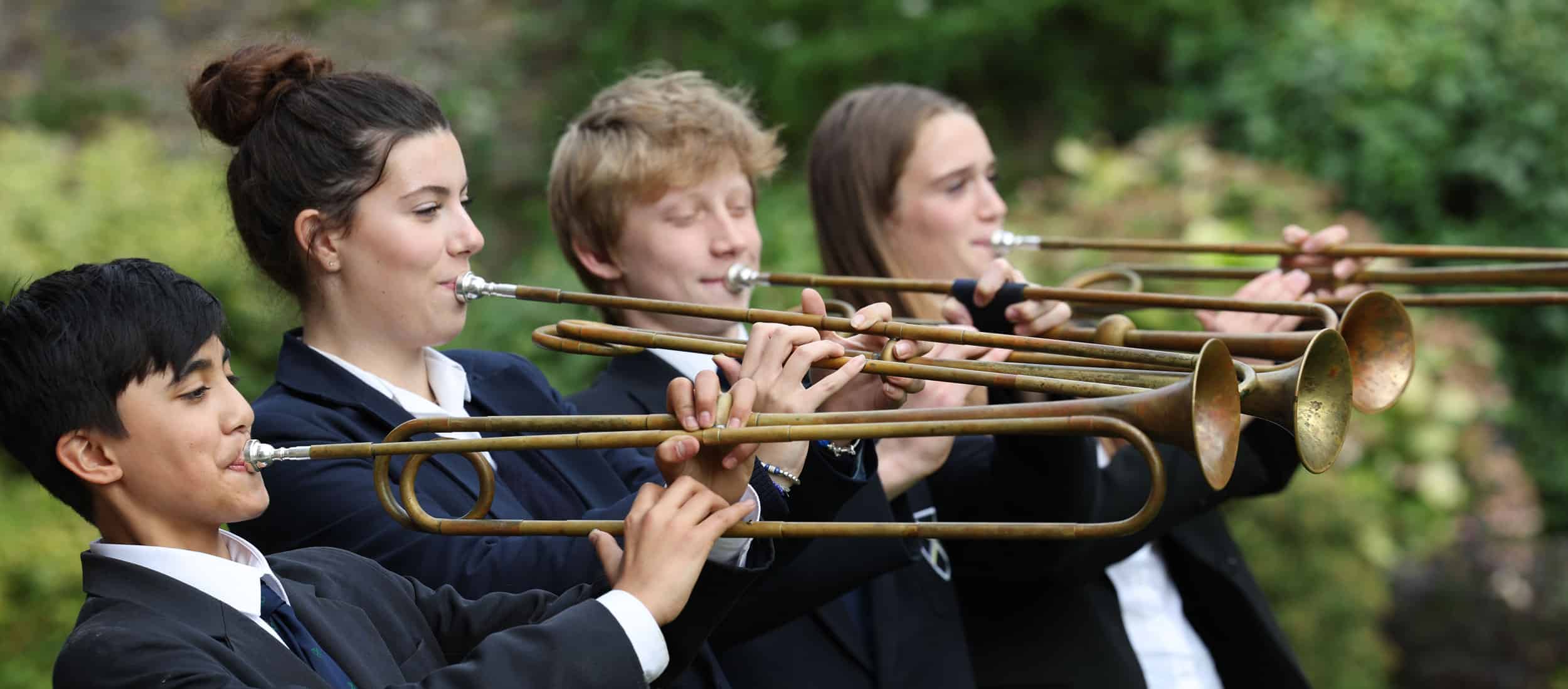 Group of pupils playing natural trumpets
