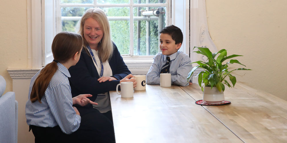Boys walking down Vicars Close at dusk